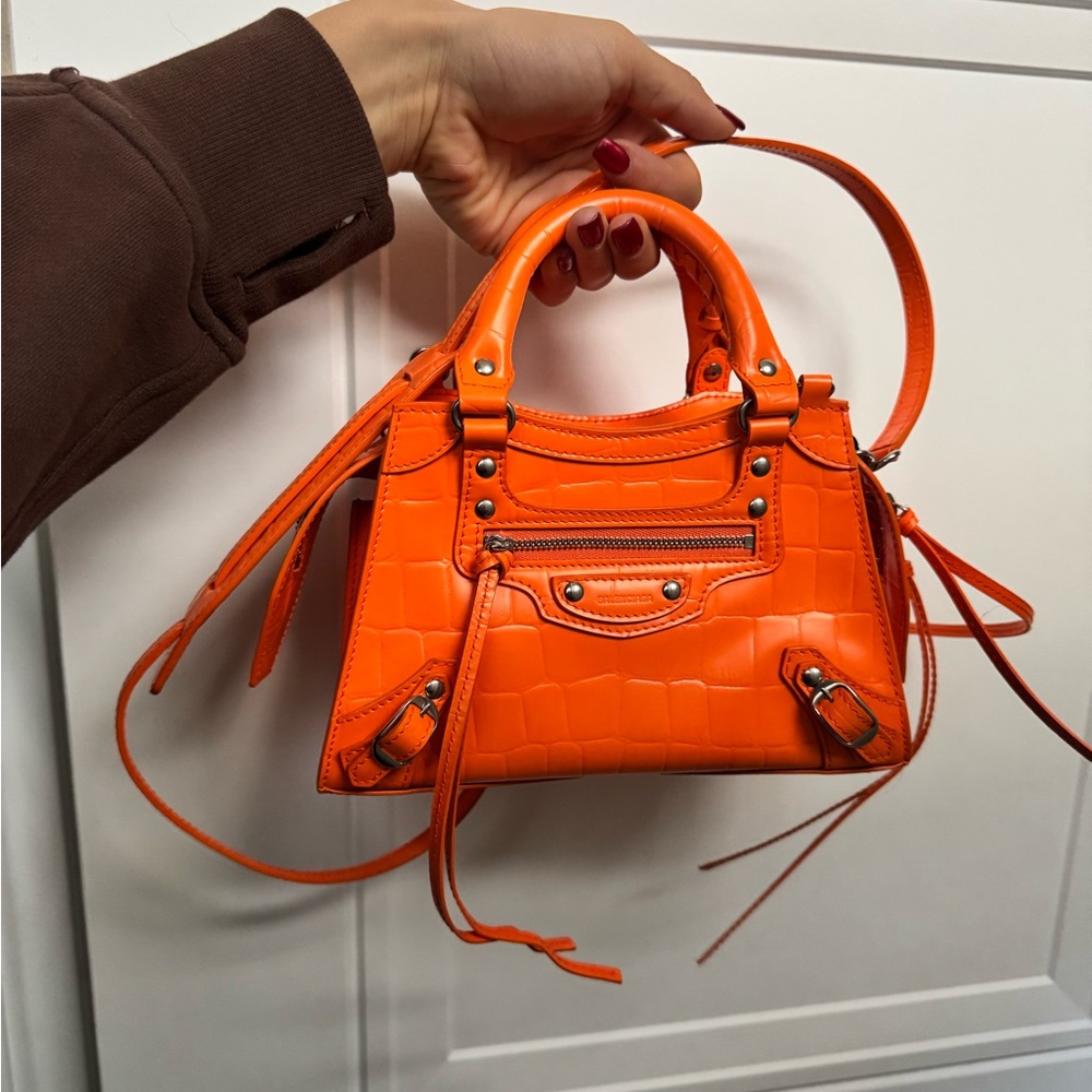 Balenciaga - Semi shiny calfskin crocodile embossed neo silver hardware. Orange.